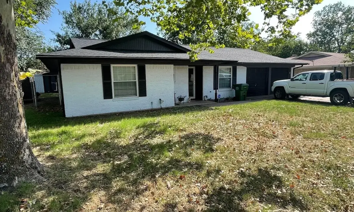 Professional roofing crew working on a residential roof in North Coventry